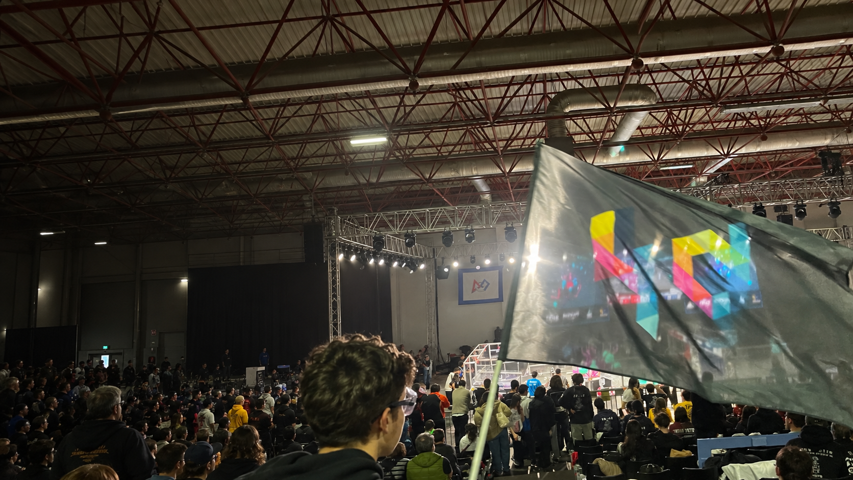 4th Dimension flag overlooking an FRC competition arena